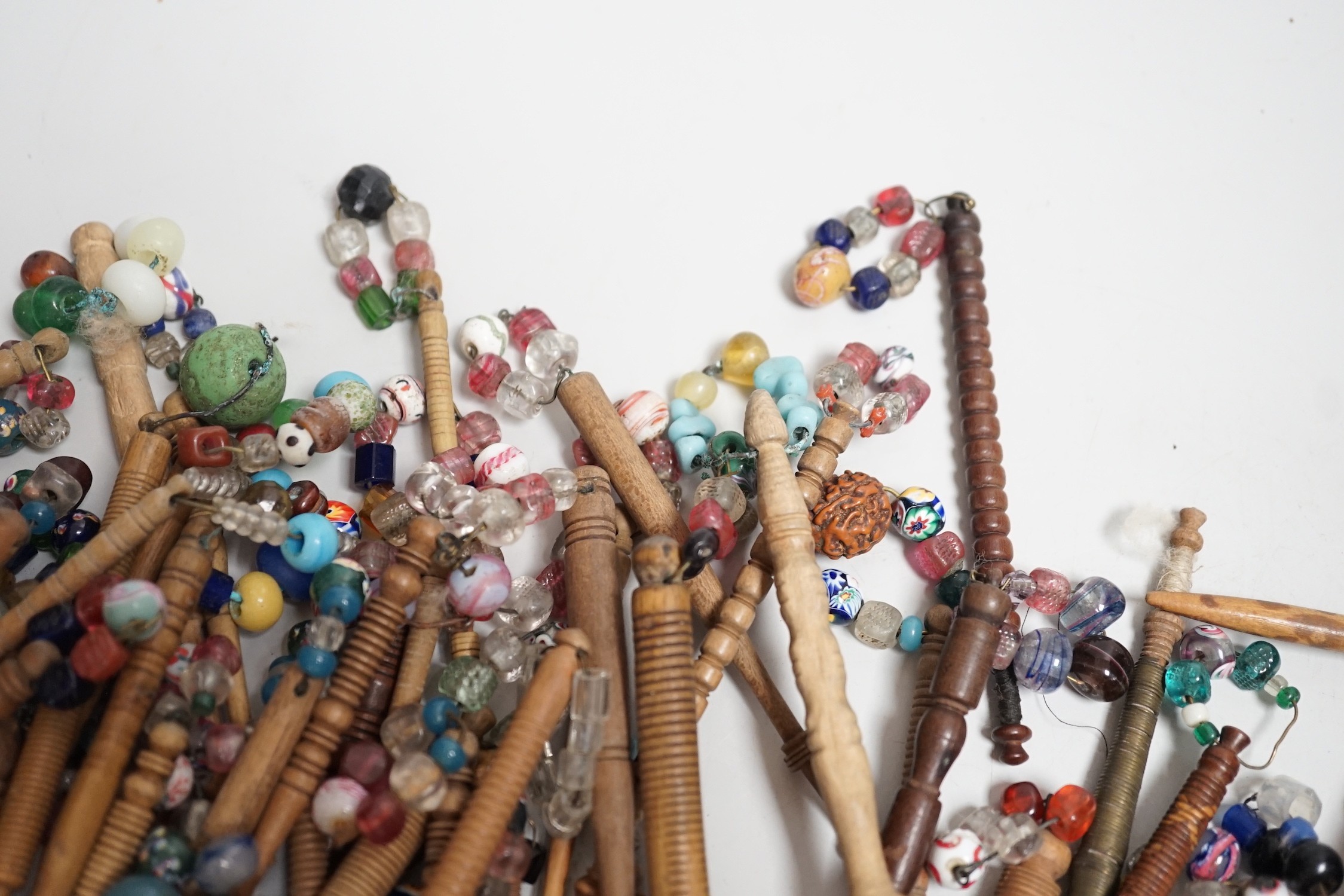 Fifty 19th century finely turned wooden lace bobbins with beaded ends together with 35 ornate wooden bobbins with beaded ends and 5 plain wooden bobbins unleaded (90)